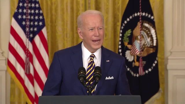 President Biden defends first year record as approval slumps