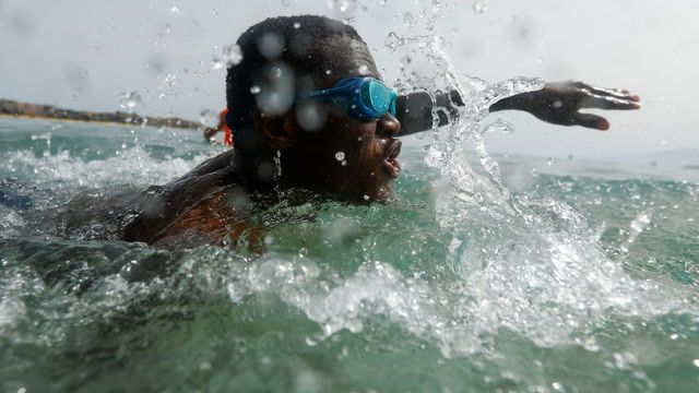Migrants learn to swim after surviving crossing